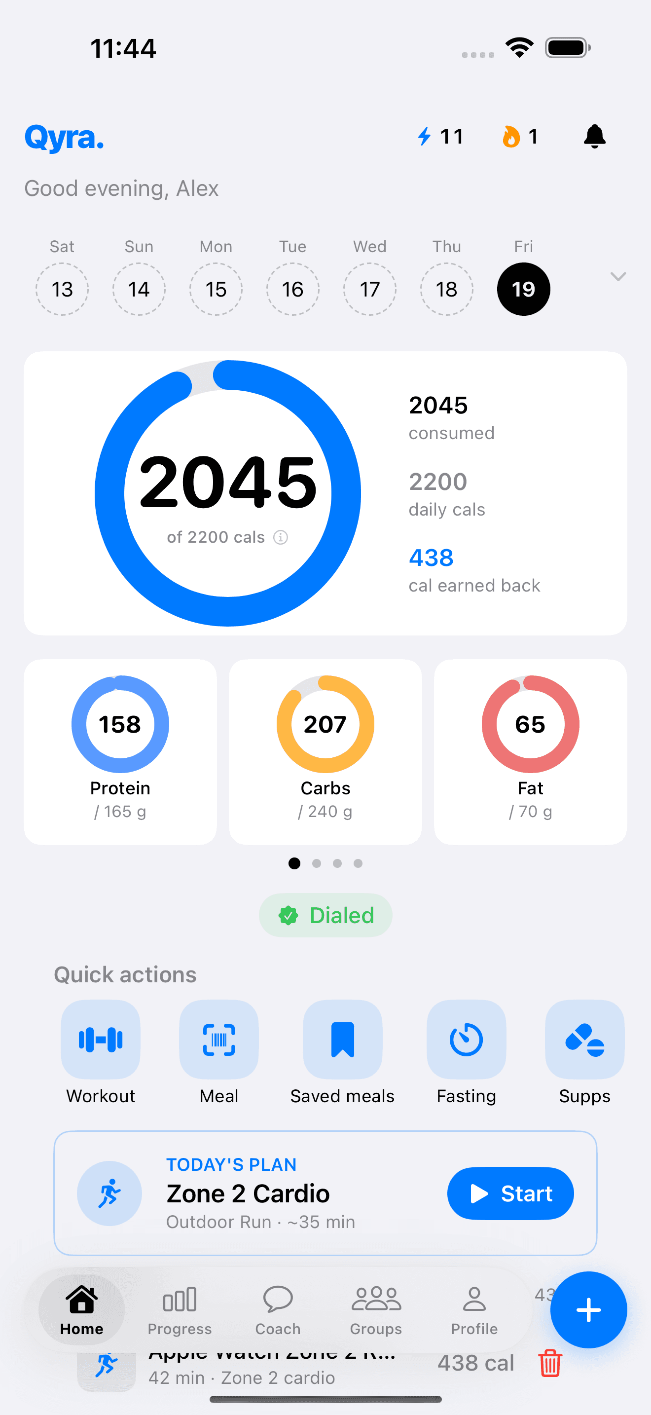 Qyra home dashboard with calories, macros, quick actions, workouts, and meals